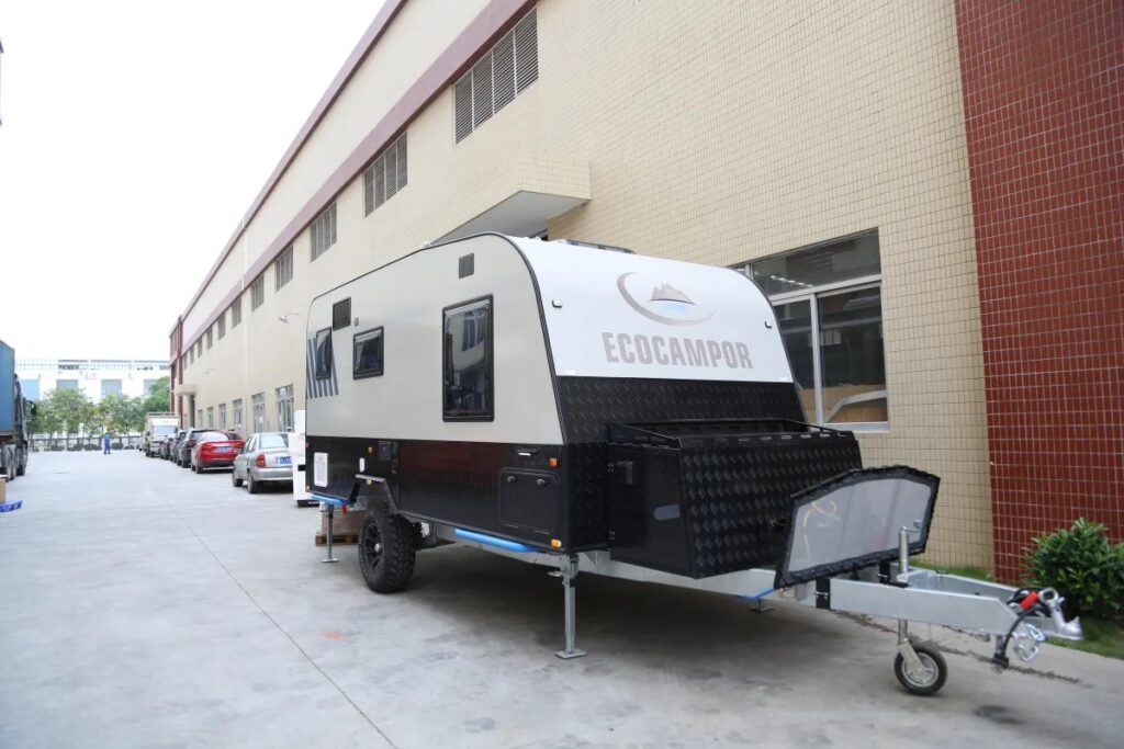 Off Road Camping Trailer Parked Next To Building