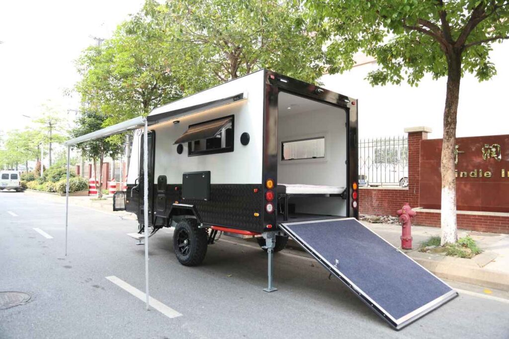 Toy hauler small camping trailer with awning and ramp