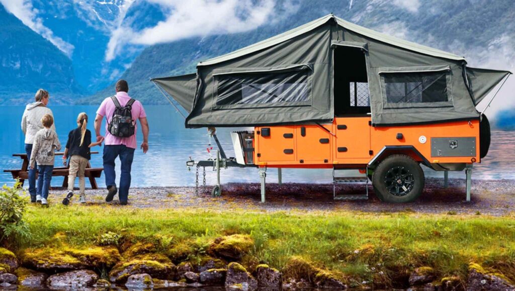 Family camping in an off-road pop up small camper