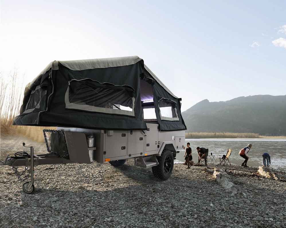 Family camping in off-road pop up by the lake